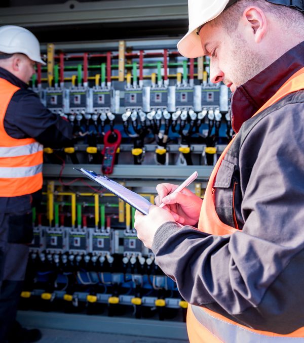 Checking the operating voltage levels of the solar panel switchgear compartment.
